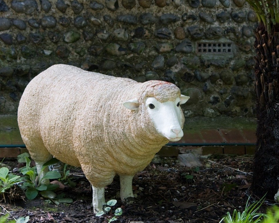 ceramic sheep in the garden