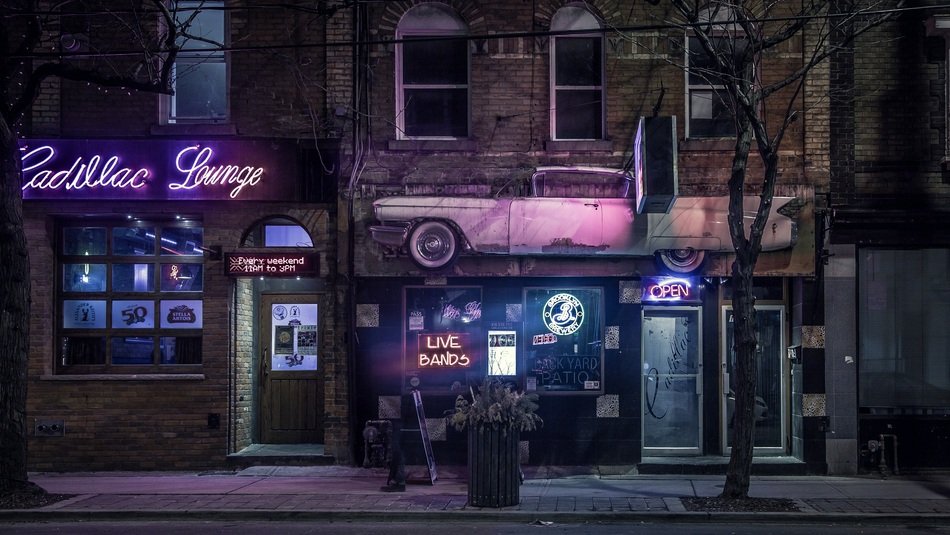 neon sign on a house at night