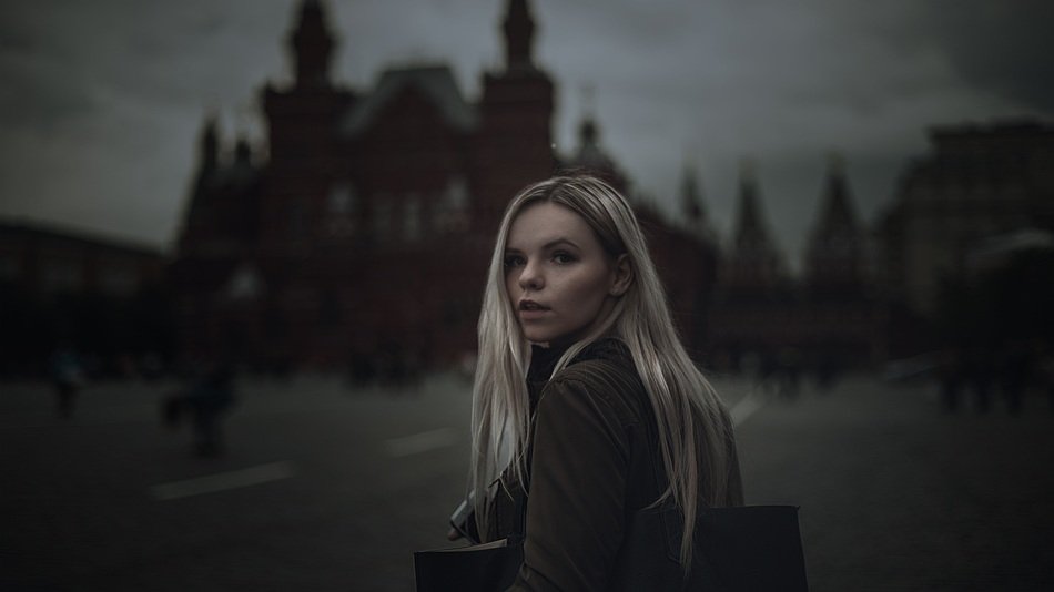 girl on red square in the dark