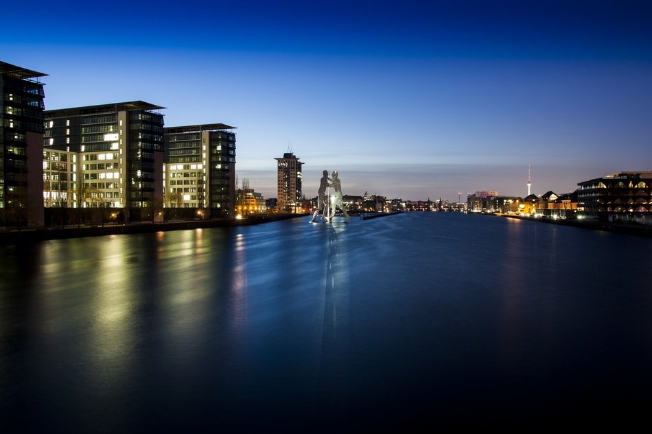 buildings near the river at night in berlin