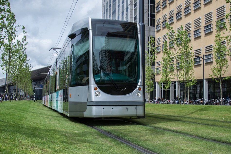 Urban Train among the plants near the building