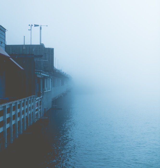 city harbor in the fog