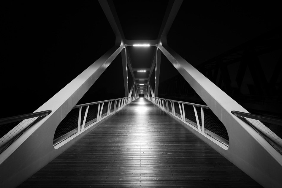 black and white photo of a modern bridge