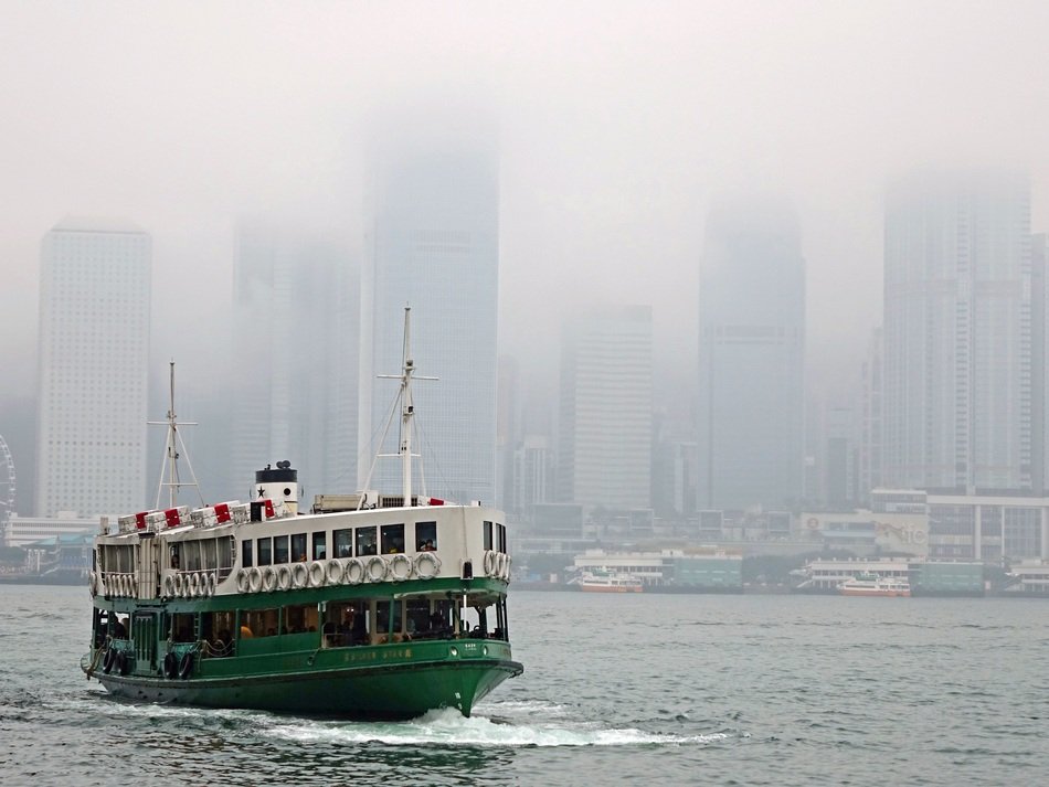 ferry boat in victoria harbor in heavy fog