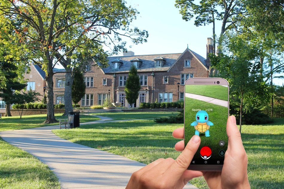 man catches pokemon on the phone
