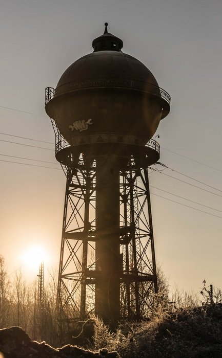 water tower on sunset background