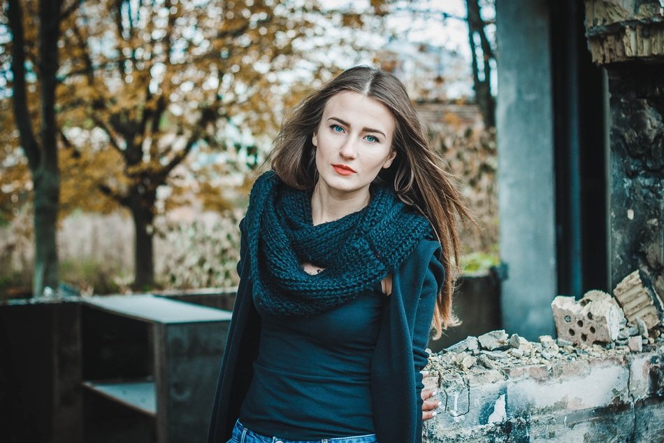 beautiful lady near abandoned building