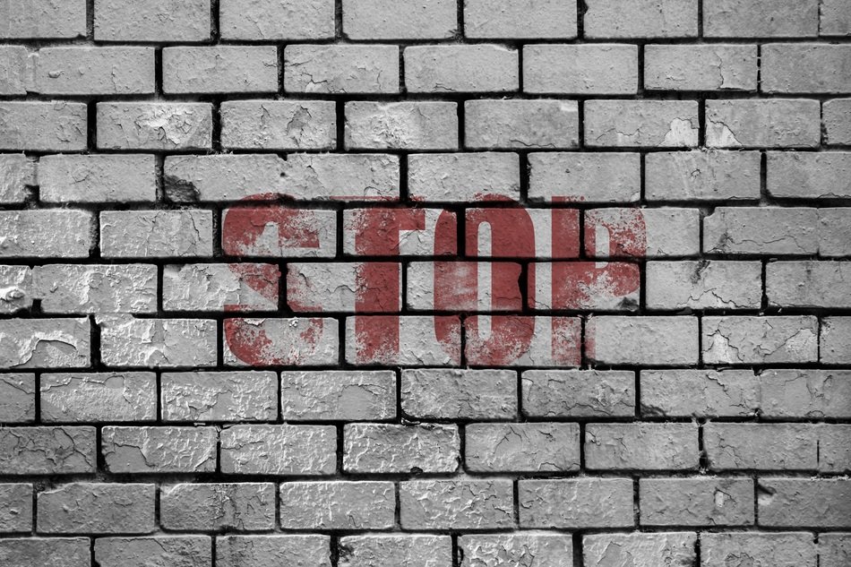 Sign of stop on a wall