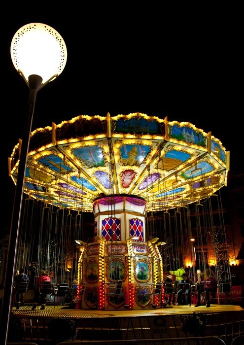 carousel in the light of lanterns at night