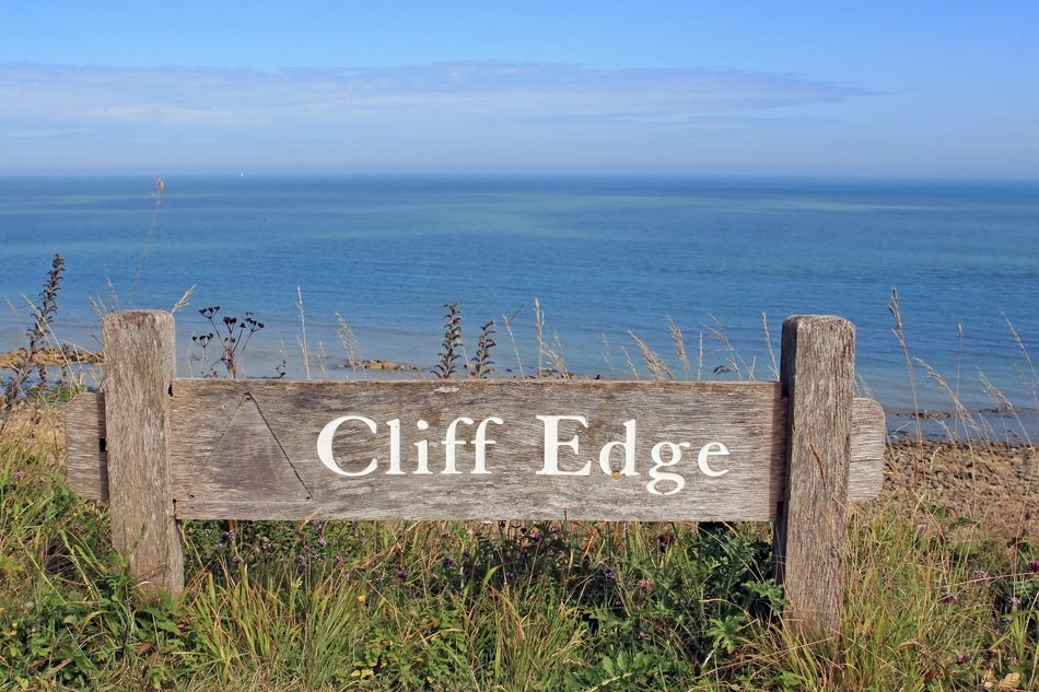 sign on the hill near the beach