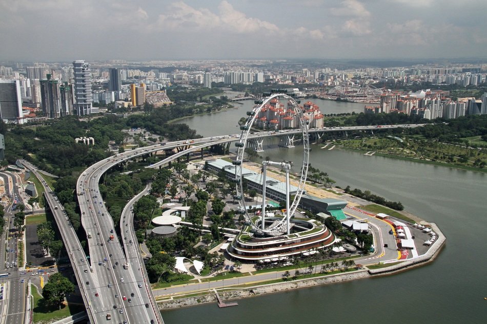 Ferris wheel in Singapore among the buildings on the airview