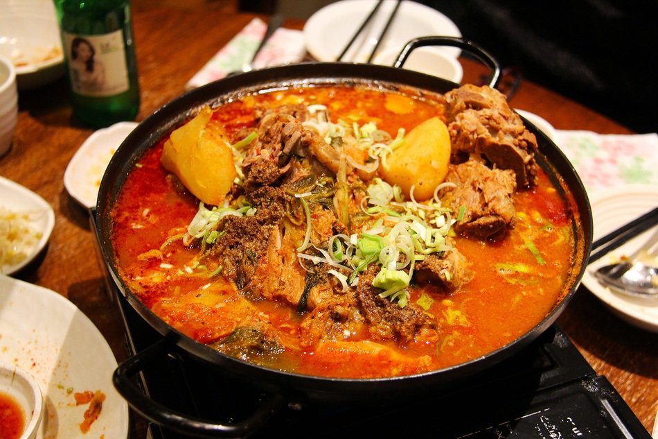 Delicious meal in pan on table