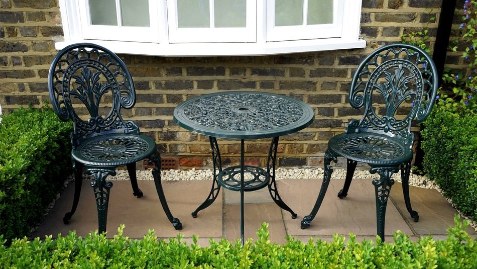 vintage wrought iron Chairs and round table Outdoor at Summer