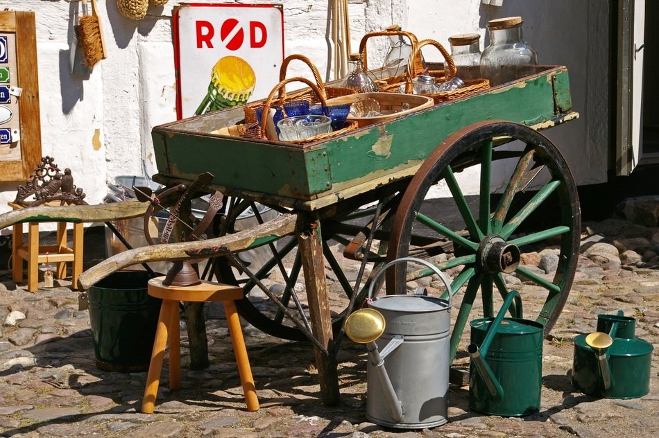 watering cans in the old wagon