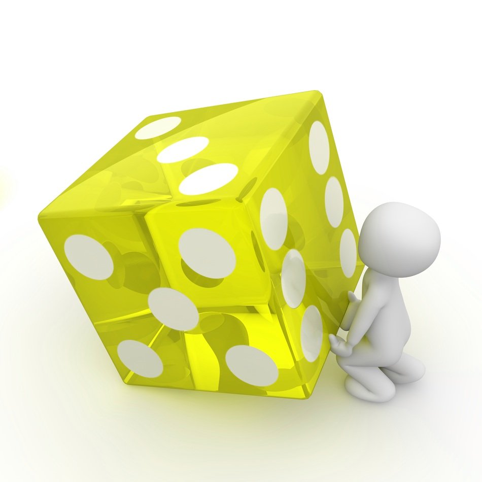 athlete raises the yellow cube