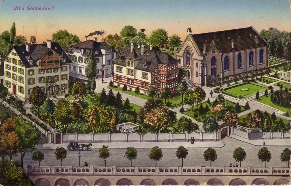 postcard with villa Zekendorf among the colorful plants