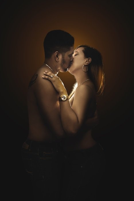 couple kiss in the dark