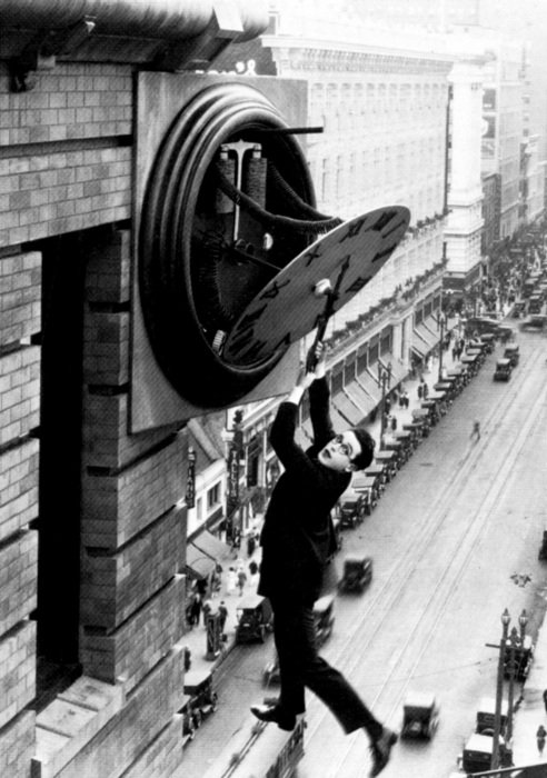 people hanging on the town clock