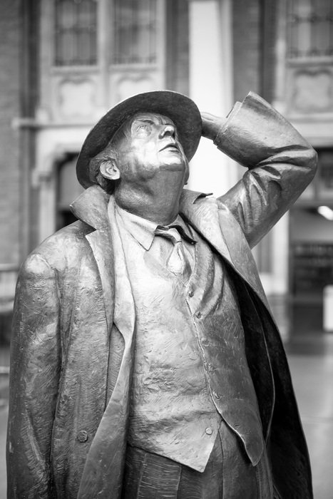 black and white photo of a statue of a man