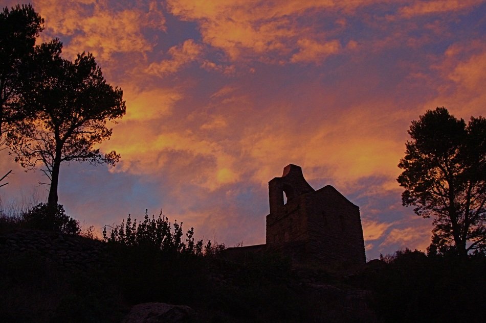 Silhouette of monastery ruins at Colorful Sunset sky