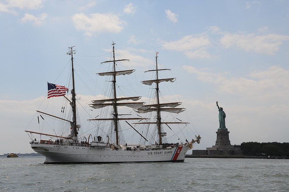 cutter ship with three masted and statue of liberty