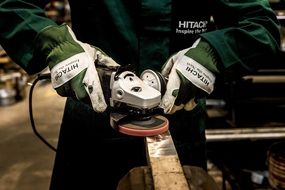 working with grinder Hitachi