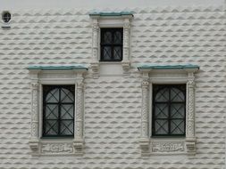 windows on the old historical building wall in moscow