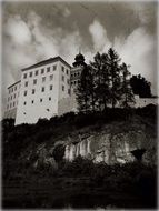 black and white photo of the castle on the mountain