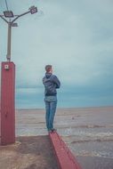 man looking at sea