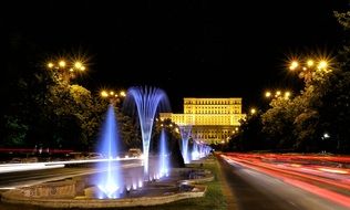 Colorful illuminated fountains in night City