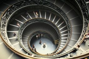 people on spiral Stairs in vatican museum, italy, Rome