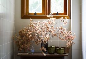 flowers in a vase on the table in the morning
