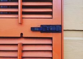 black Latch on red wooden door