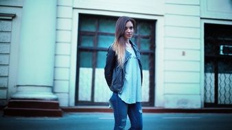 Beautiful longhaired Girl in leather jacket on Street