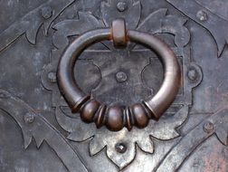 metal door with a knocker in Warsaw, Poland