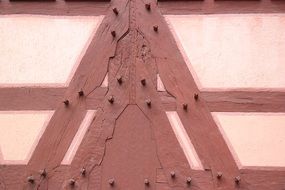 wooden nails on the facade of a farm building