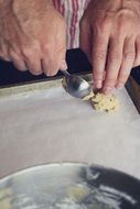 baker making cookies with dough