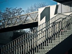staircase with railing at the transition
