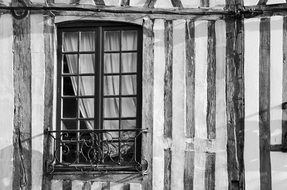 black and white photo of destroyed house in village