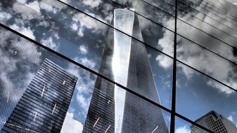 reflection of skyscrapers on the glass facade