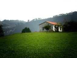 green meadow and village house in Cantabria