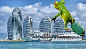 green frog on the background of the big city