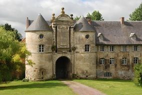 panorama of a castle with towers among nature