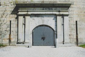 arched double doors to the building