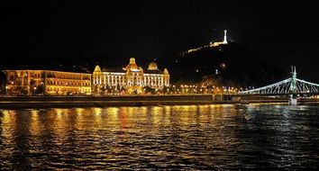 landscape of illuminated liberty bridge and parliament building at night, hungary, Budapest