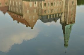 reflection of the castle in a quiet pond