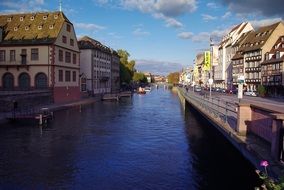 river in the city among the houses