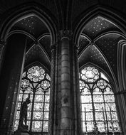 black and white photo of windows in a church