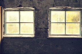two windows in a brick house