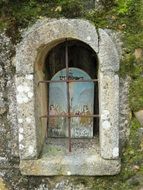 window of a stone temple in portugal